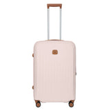 Bric's Taormina 27-inch expandable medium spinner suitcase with hard shell, four wheels, and silver handle for travel.