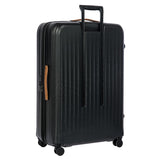 Bric's Taormina 32-inch expandable spinner suitcase with large capacity and four wheels, black color, and sturdy handle.