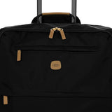 Black Bric's X-Collection 27-inch checked spinner suitcase with four wheels and a modern design.