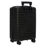 Bric's B|Y Ulisse 21-inch carry-on spinner luggage with four wheels and a sleek design, suitable for travel.
