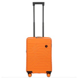 Bric's B|Y Ulisse 21-inch expandable spinner luggage with hard shell and four wheels, shown in a sleek silver finish.