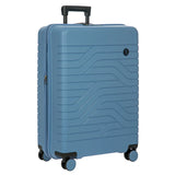 Bric's B|Y Ulisse 27.5-inch expandable spinner luggage with sleek design and four wheels for easy travel.