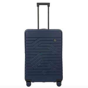 Bric's B|Y Ulisse 27.5-inch expandable spinner luggage with hard shell and four wheels, in a sleek design.