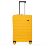 Bric's B|Y Ulisse 27.5-inch expandable spinner luggage with hard shell, four wheels, and telescopic handle for travel.