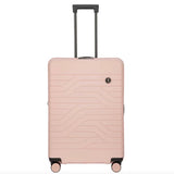 Bric's B|Y Ulisse 27.5-inch expandable spinner luggage with four wheels and a sleek black design.