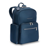 Navy Briggs & Riley Rhapsody medium backpack with multiple compartments and padded shoulder straps, designed for travel and daily use.
