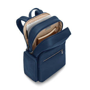 Navy Briggs & Riley Rhapsody medium backpack with padded shoulder straps and multiple compartments for travel and daily use.