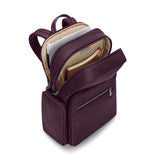 Navy Briggs & Riley Rhapsody medium backpack with padded shoulder straps and multiple compartments for travel and daily use.