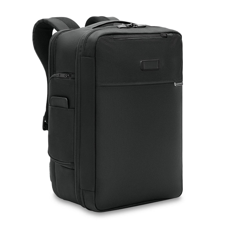 Briggs & Riley Baseline medium convertible backpack shown from an angled view with multiple compartments and padded straps.