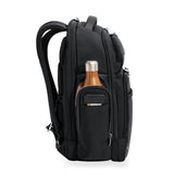 Briggs & Riley @work large cargo backpack showing side view with multiple compartments and padded straps for travel and work.