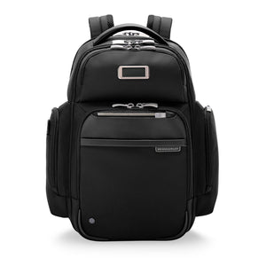Black Briggs & Riley @work medium cargo backpack showing multiple compartments and padded straps for comfortable carrying.