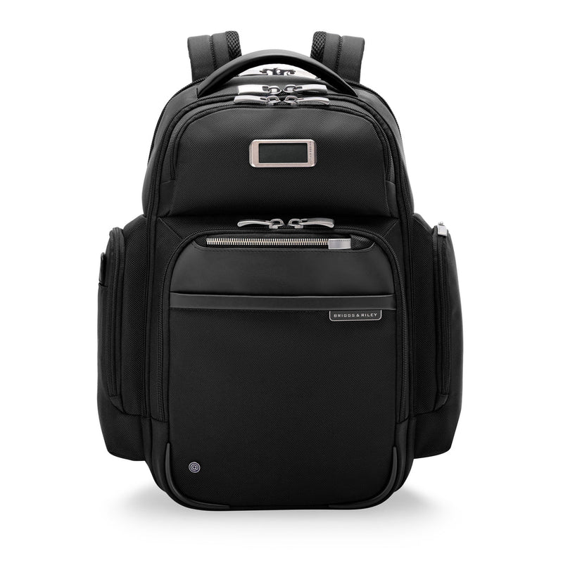 Black Briggs & Riley @work medium cargo backpack showing multiple compartments and padded straps for comfortable carrying.
