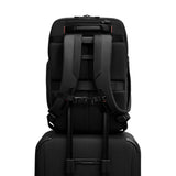 Black Briggs & Riley ZDX U-Zip travel backpack with multiple compartments and padded shoulder straps for comfortable carrying.