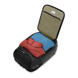 Black Briggs & Riley ZDX U-Zip travel backpack with multiple compartments and padded straps, designed for convenient carrying.