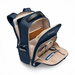 Interior view of Briggs & Riley @work medium backpack showing organized compartments and padded laptop sleeve.