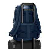 Briggs & Riley @work medium backpack with pass-through sleeve, black nylon material, multiple compartments, and padded shoulder straps.