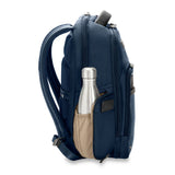 Briggs & Riley @work medium backpack shown from the side with multiple compartments and padded shoulder straps.