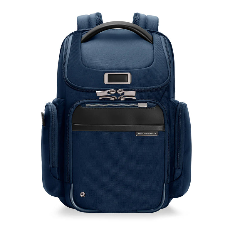Briggs & Riley @work medium wide-mouth backpack showing front view with adjustable straps and multiple compartments.