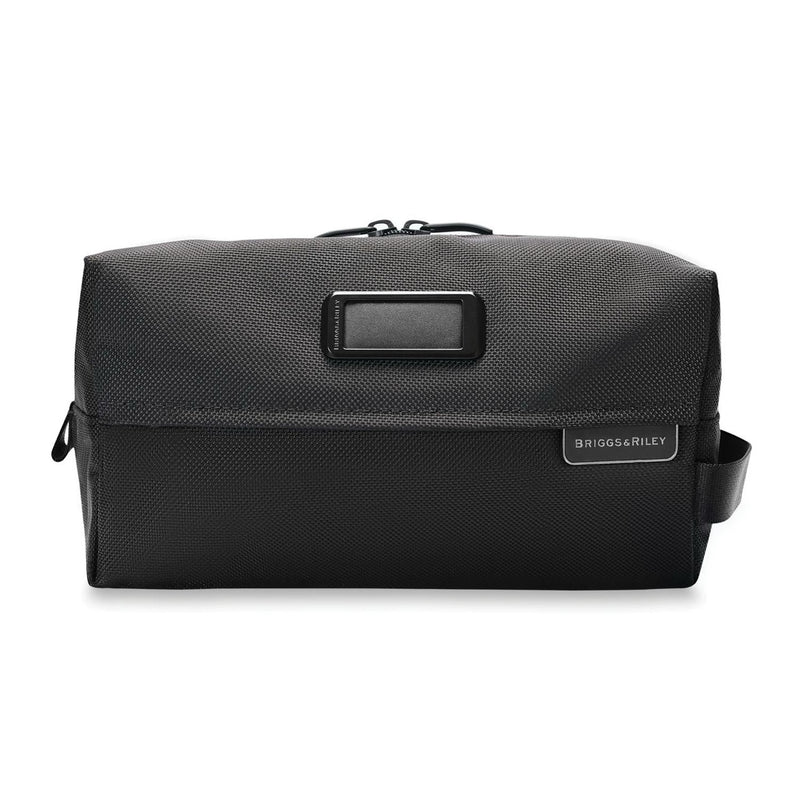 Briggs & Riley Everyday Essentials Kit with organized compartments and travel accessories in a black compact case.