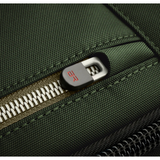 Black Briggs & Riley H-T-A slim expandable backpack with multiple compartments and padded straps for comfortable carrying.