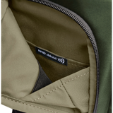 Black Briggs & Riley H-T-A Slim Expandable Backpack with multiple compartments and padded straps for comfortable carrying.