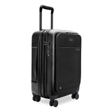 Black Briggs & Riley Sympatico Essential 22-inch expandable spinner carry-on luggage with front pocket and 360-degree wheels.