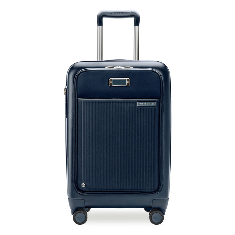 Black Briggs & Riley Sympatico Essential 22-inch expandable spinner carry-on luggage with front pocket and four wheels.