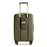 Briggs & Riley Sympatico Essential Carry-On Expandable Spinner luggage with four wheels and a sleek navy blue exterior.