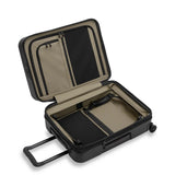Open view of Briggs & Riley ZDX 21-inch expandable hardside carry-on spinner luggage with interior compartments and sturdy wheels.