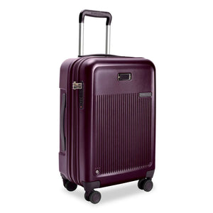 Briggs & Riley Sympatico Essential 22-inch plum carry-on luggage with expandable spinner wheels and sleek hard-shell design.