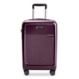 Briggs & Riley Sympatico 22-inch plum expandable spinner carry-on luggage with four wheels and telescopic handle.