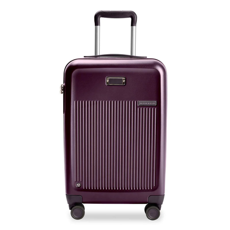 Briggs & Riley Sympatico 22-inch plum expandable spinner carry-on luggage with four wheels and telescopic handle.