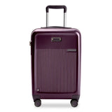 Briggs & Riley Sympatico 22-inch plum expandable spinner carry-on luggage with four wheels and telescopic handle.