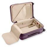 Briggs & Riley Sympatico Essential 22-inch plum carry-on luggage with expandable spinner wheels and sleek hard-shell design.