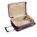 Briggs & Riley Sympatico Essential 22-inch plum expandable carry-on spinner luggage with four wheels and TSA lock.