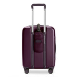 Briggs & Riley Sympatico global carry-on expandable spinner luggage in plum color with four wheels and telescopic handle.