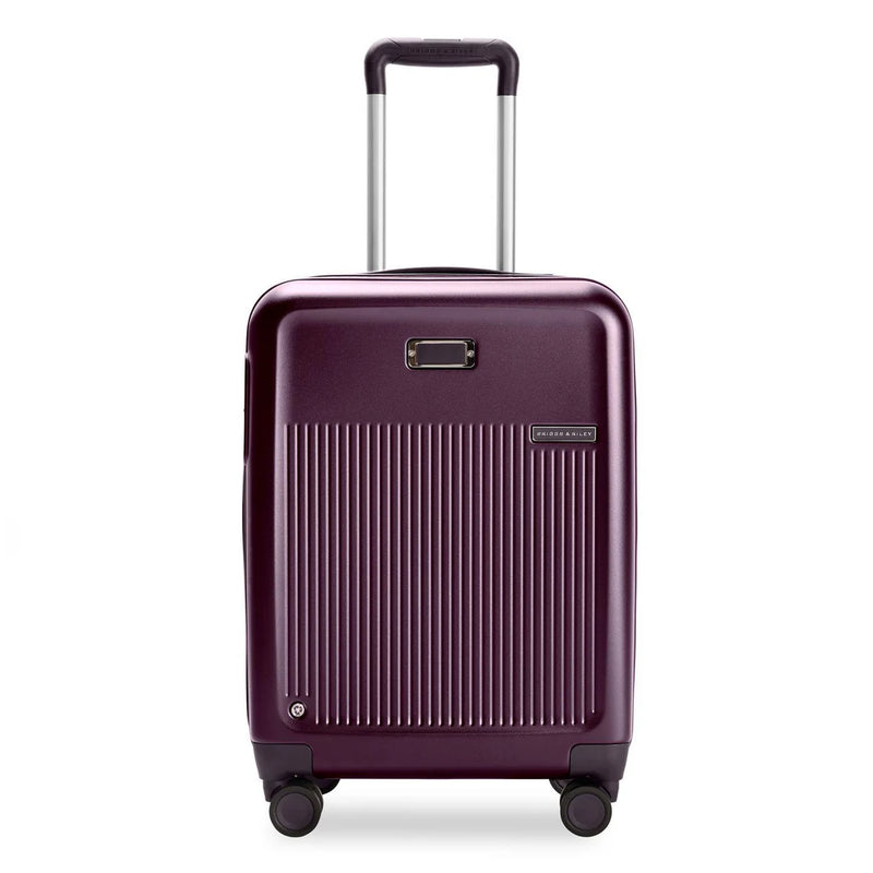 Briggs & Riley Sympatico plum carry-on luggage with expandable spinner wheels, lightweight and durable for travel.