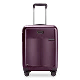 Briggs & Riley Sympatico global carry-on expandable spinner suitcase in plum, featuring four wheels and telescopic handle.