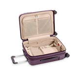 Briggs & Riley Sympatico plum carry-on luggage with expandable spinner wheels, durable hard shell, and sleek design.