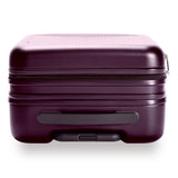 Briggs & Riley Sympatico plum expandable carry-on spinner luggage with four wheels and telescoping handle.