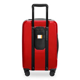 Briggs & Riley Sympatico Essential Carry-On Spinner luggage in glossy ruby with four wheels and a sleek design.