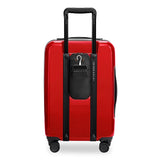 Briggs & Riley Sympatico Essential Carry-On Spinner luggage in glossy ruby, with four spinner wheels and a sleek hard-shell exterior.