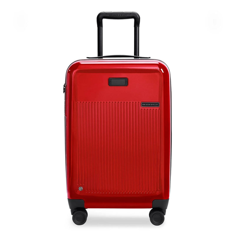Briggs & Riley Sympatico essential carry-on spinner luggage in glossy ruby with front view and four wheels.