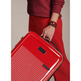 Briggs & Riley Sympatico glossy ruby carry-on spinner luggage with four wheels and sleek design.