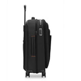Briggs & Riley ZDX Essential Carry-On Expandable Spinner luggage with side view showing durable black exterior and four spinner wheels.