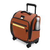 Briggs & Riley ZDX cabin spinner carry-on luggage with durable exterior and four wheels, shown with a water bottle in front.