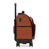 Briggs & Riley ZDX cabin spinner carry-on luggage with side view showing durable hard-shell design and four spinner wheels.