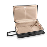 Black Briggs & Riley Sympatico large expandable spinner checked luggage with four wheels and handle, ready for travel.