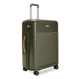 Black Briggs & Riley Sympatico large expandable checked luggage with spinner wheels and durable exterior.