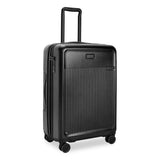 Black Briggs & Riley Sympatico medium expandable spinner checked luggage with four wheels and handle, ready for travel.